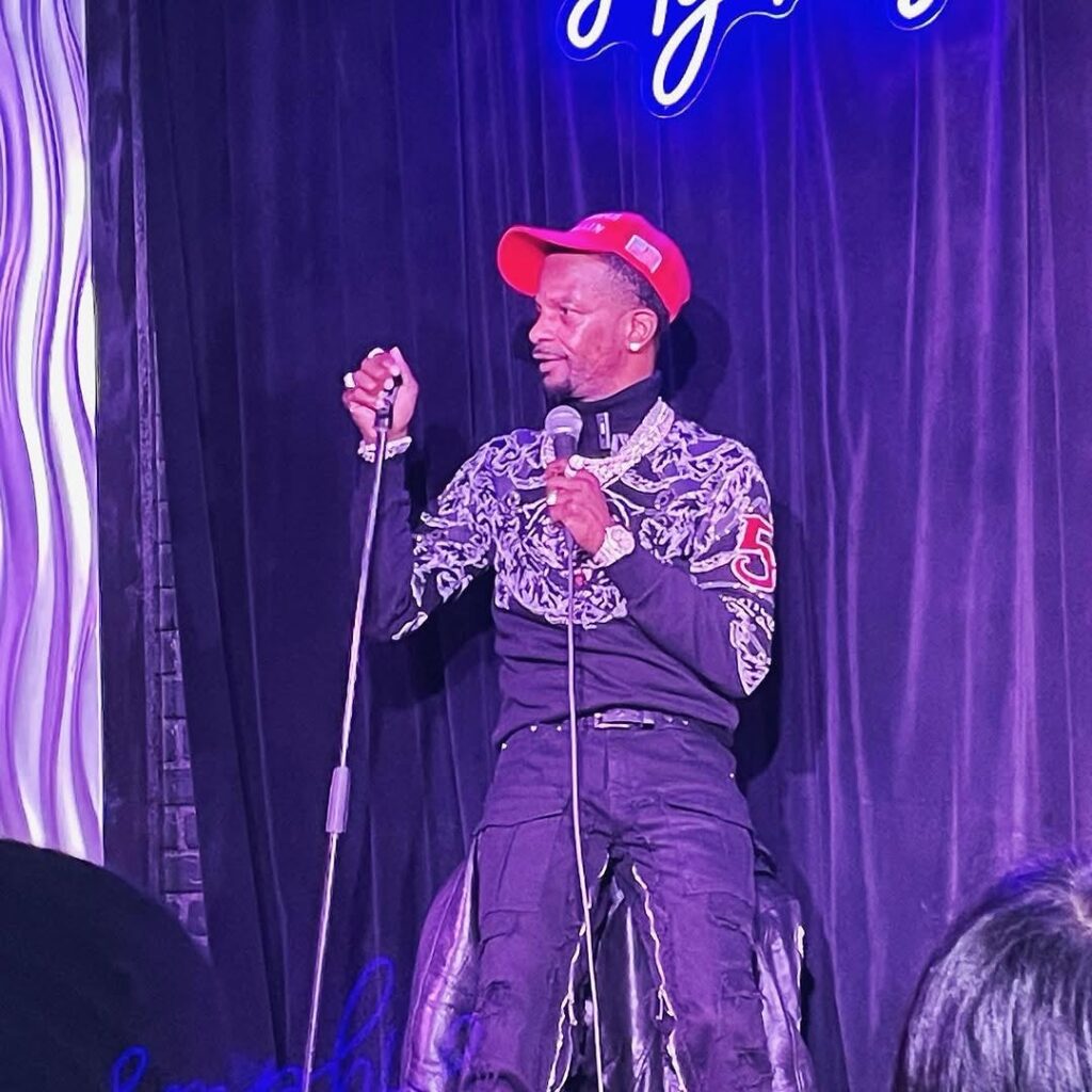 Charleston White on mic on a comedy stage