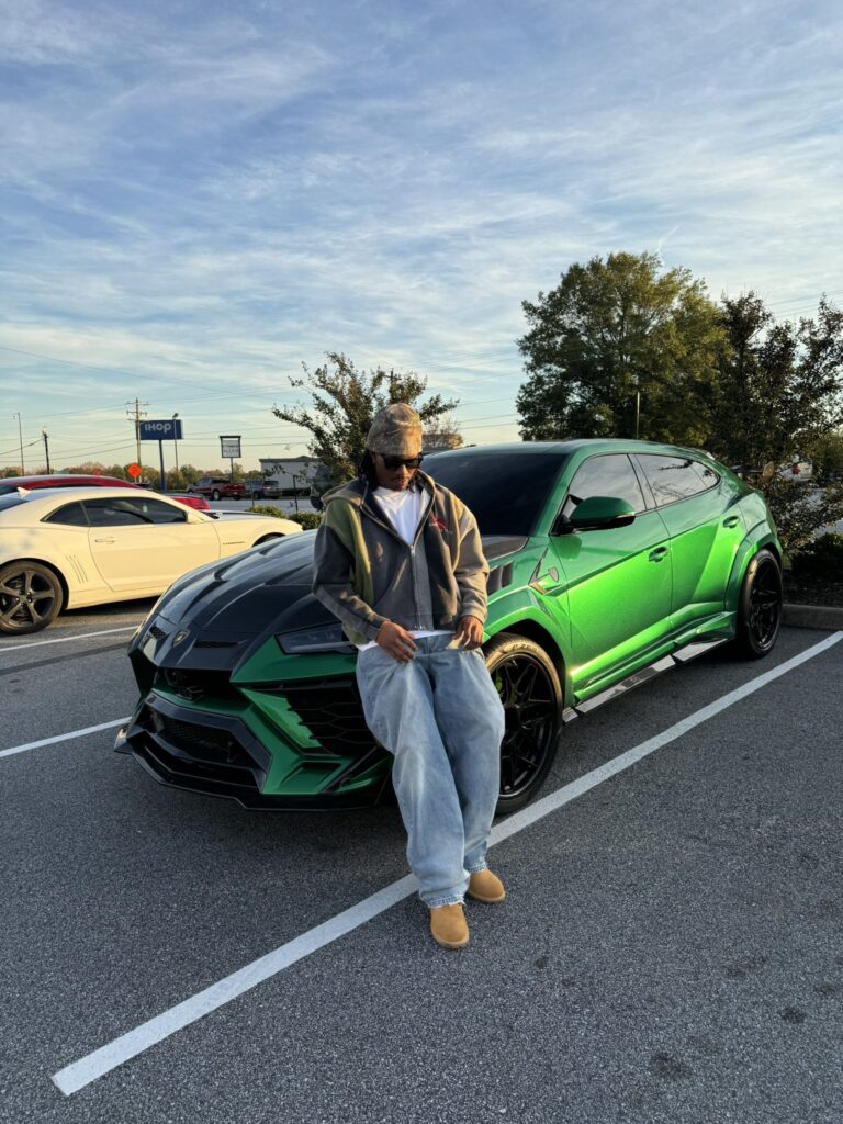 Duke Dennis with his car