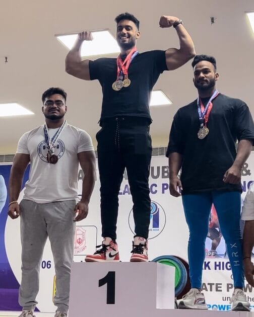 Mannu with his gold medal on the podium