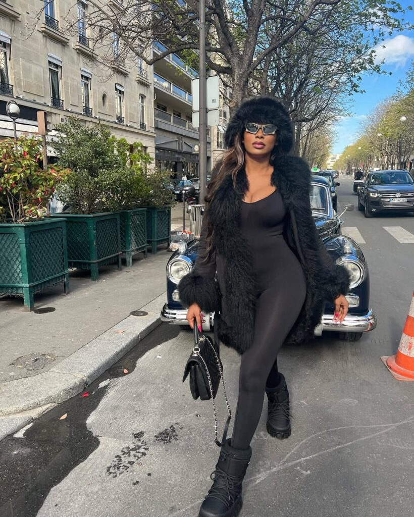 Sophia Egbueje walking on street in stylish attire