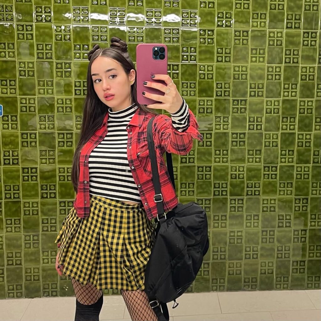 Priscilla Delgado taking mirror selfie